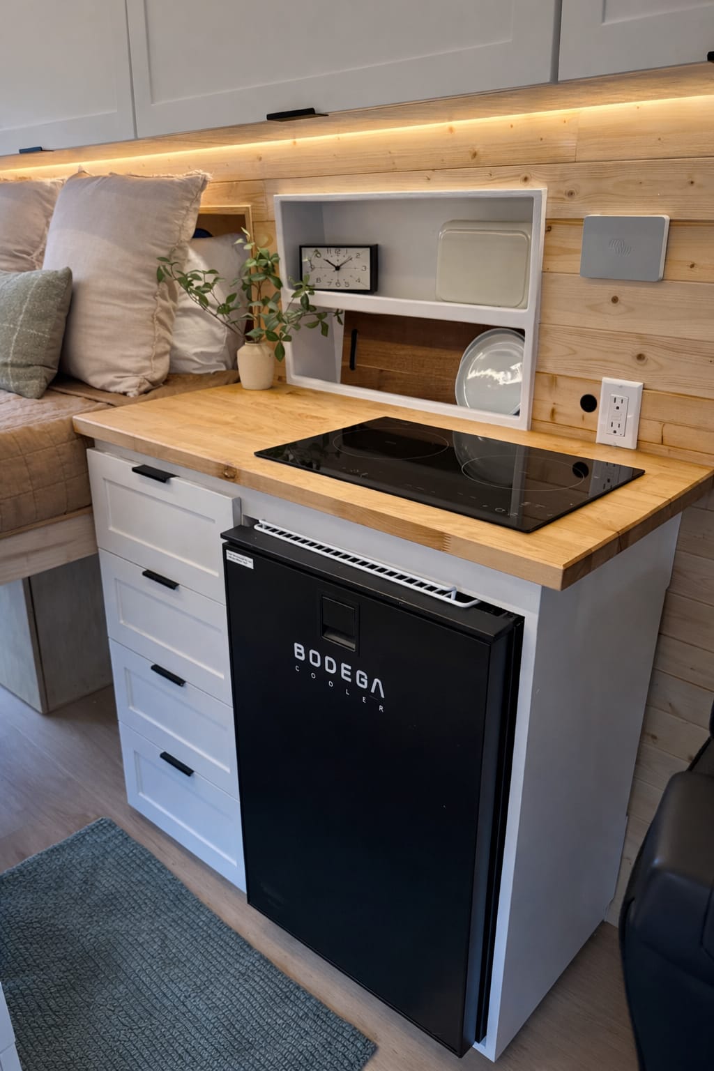 12V compressor fridge installed in a custom van conversion kitchen