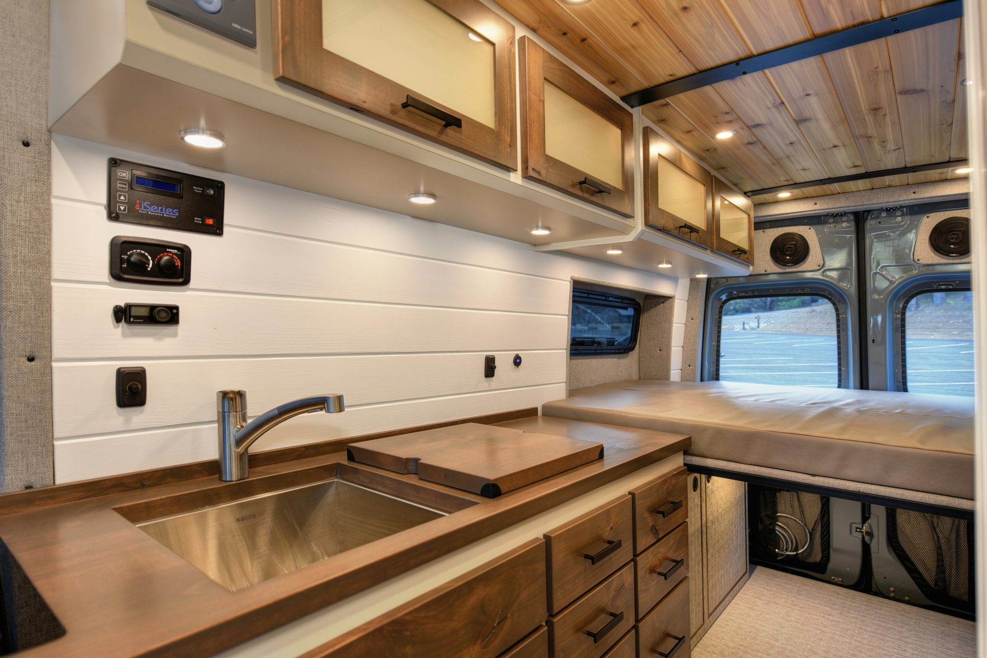 Custom van conversion kitchen with walnut counters